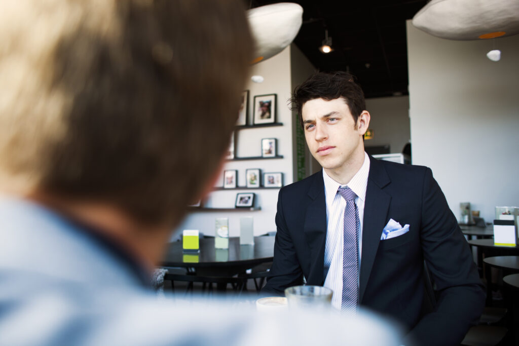 A sales professional in a client meeting